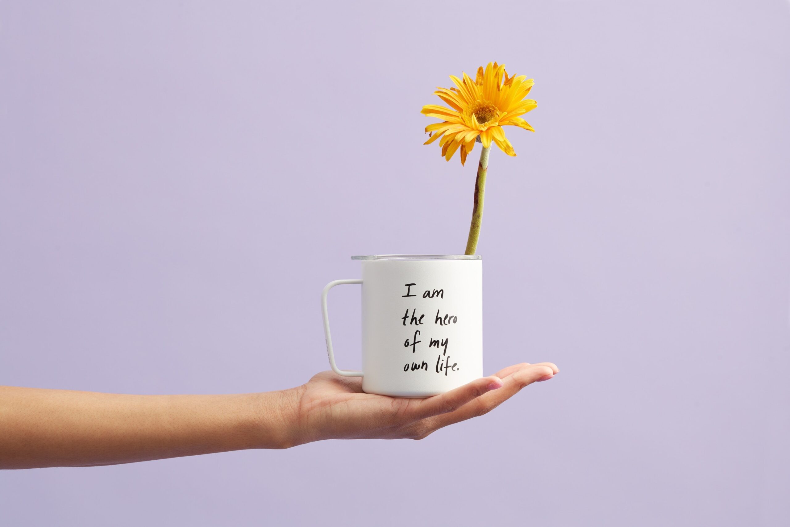 Photo of Yellow Petaled Flower In White Mug